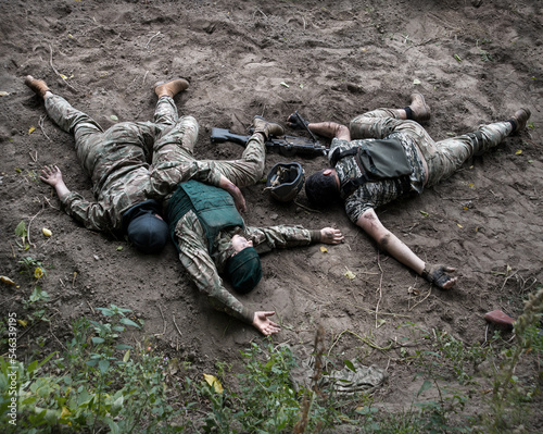 Wounded soldiers lie on the battlefield