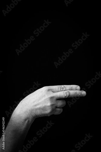 Hand demonstrating the Arabic sign language letter 'ع' or 'Ayn'