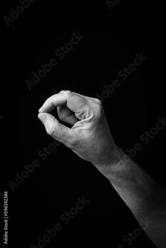 Hand demonstrating the Arabic sign language letter 'ف' or 'Fa'