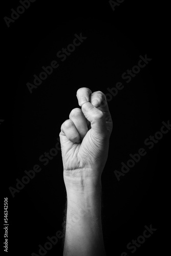 Hand demonstrating the Arabic sign language letter 'ق' or 'Qaf' photo