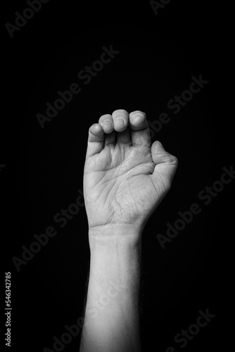 Hand demonstrating the Arabic sign language letter 'ح' or 'Ha'