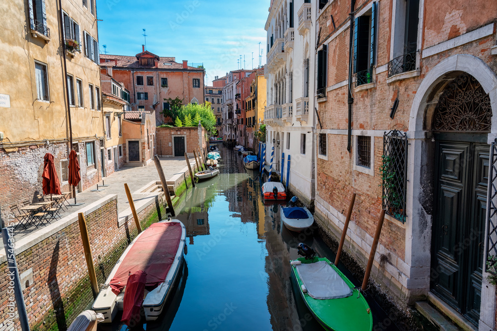 Characteristic views of the city of Venice. Boats, gondolas and canal.