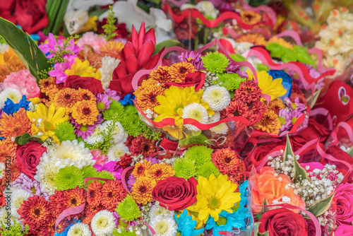 Background composed of various colorful bouquets of flowers