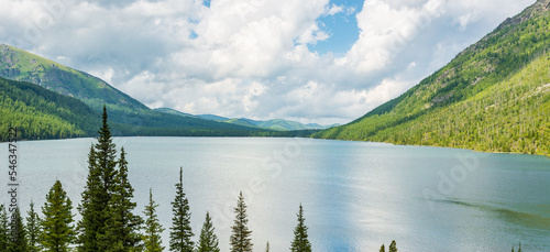Fototapeta Naklejka Na Ścianę i Meble -  Mountain landscape with beautiful view of the lake and coniferous tree tops
