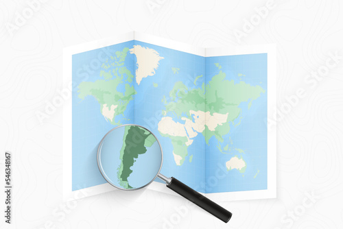 Enlarge Argentina with a magnifying glass on a folded map of the world.