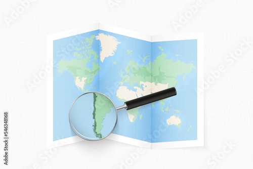 Enlarge Chile with a magnifying glass on a folded map of the world.