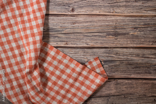 orange tablecloth on wooden table