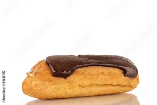 One sweet chocolate eclair on a white background, macro.