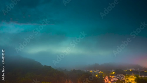 Monsoon Timelapse of 5G Communication tower during morning sunrise with thick mists and fog, Monsoon Season