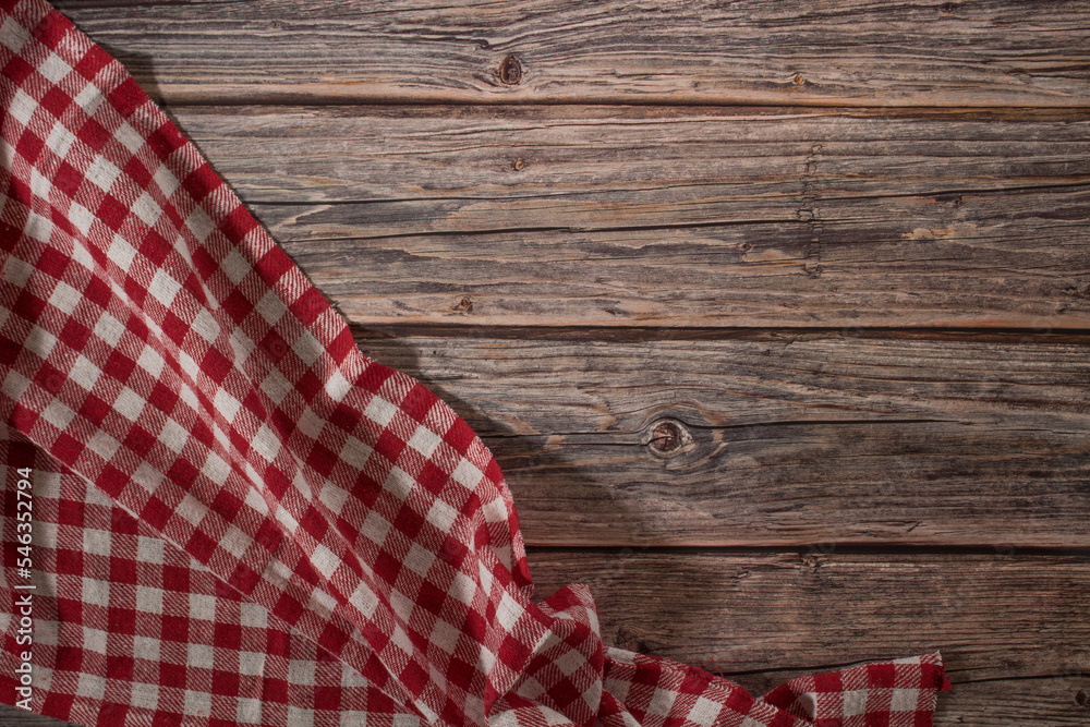 Tablecloth placed on an old wooden table in a corner Tablecloth placed on an old wooden table in a corner