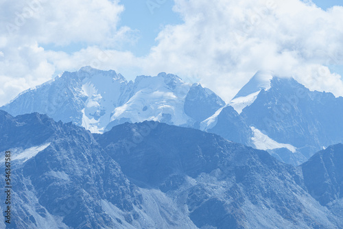 The peaks and glaciers of Engadin, seen from Piz grevasalvas, a peak near the village of Maloja, Switzerland - August 2022. photo