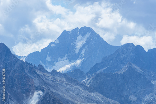 The peaks and glaciers of Engadin, seen from Piz grevasalvas, a peak near the village of Maloja, Switzerland - August 2022. photo