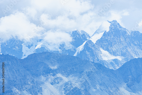 The peaks and glaciers of Engadin, seen from Piz grevasalvas, a peak near the village of Maloja, Switzerland - August 2022. photo