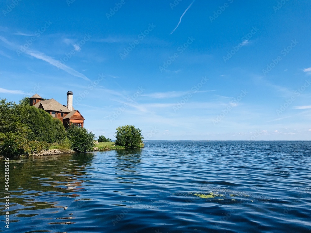 Lakeshore view of a house by the Lake with beautiful clear sky 