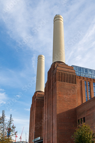 Chimneys and brick facade of iconic London landmark Battersea Power Station and surrounding area.