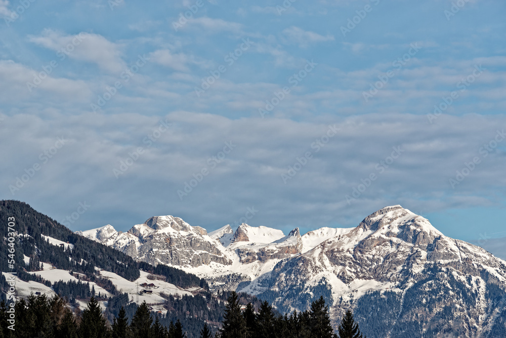 Snow-capped mountains against blue sky