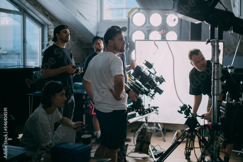 Director at work on the set. The director works with a group or with a playback while filming a movie