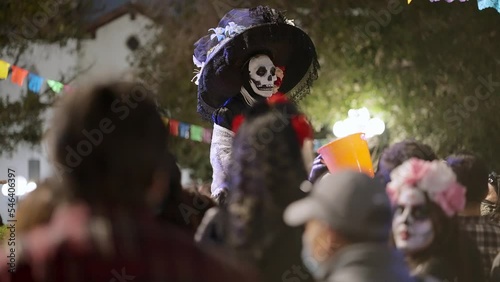 Person with the traditional skeleton custome for the day of the death, at night dia de los muertos 