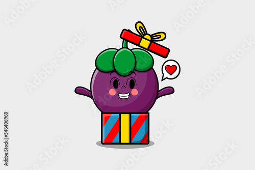 Cute cartoon Mangosteen character holding gift box in vector icon illustration