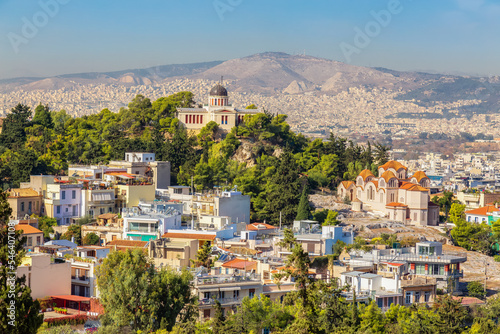 Residential Homes in a Historic City with Cityscape and Mountains in Background. Areopagus Hill, Athens, Greece.