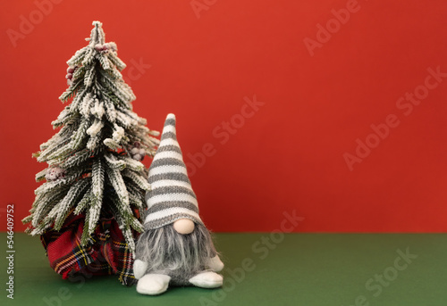 christmas tree and gnome gonk with copy space background photo