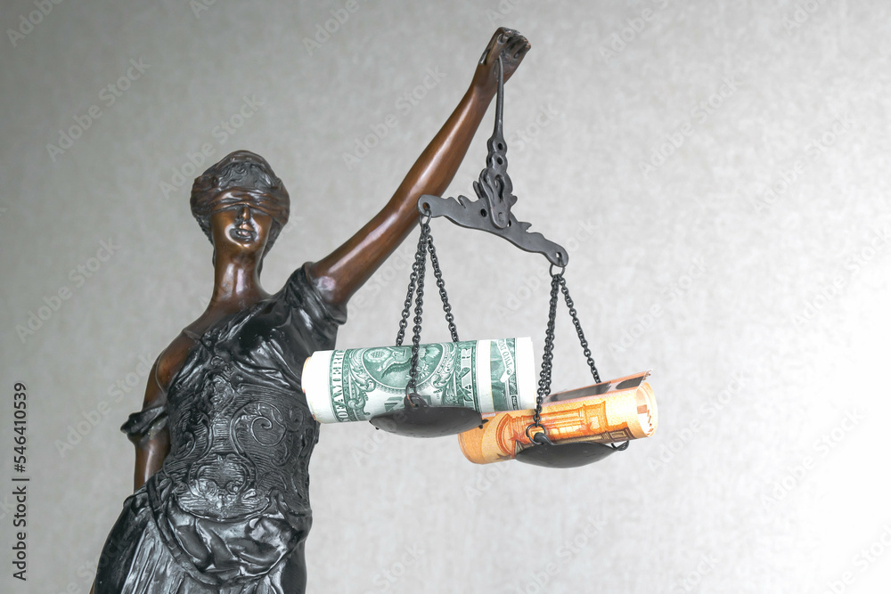 Fotografie Statue of goddess of justice Themis with money on the libra