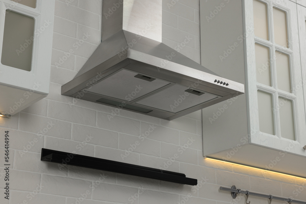 Modern range hood and furniture in kitchen Modern range hood and furniture in kitchen