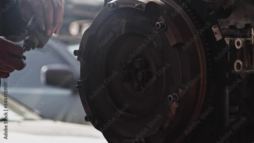 Mechanic Lubricates and Installs Car Engine Volant Gears Screws in Repair Shop Footage.