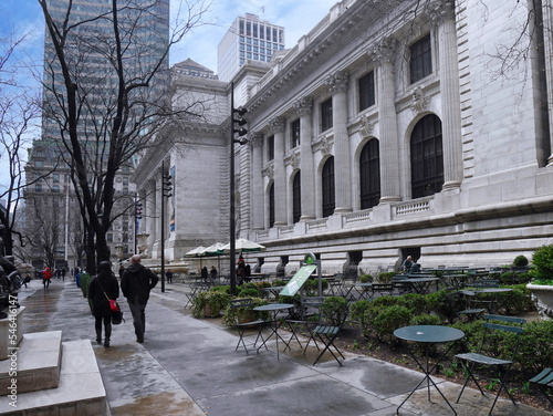 New York, NY - People walk among the bare trees in front of the New York Public Library main branch on Fifth Avenue photo