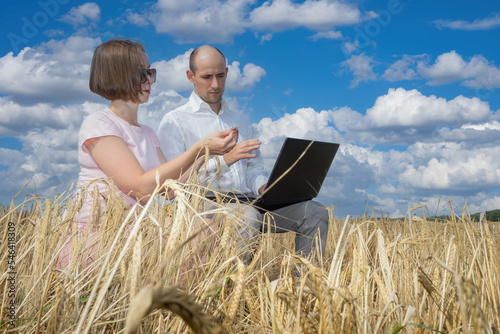 Agronomists at work. Man an...