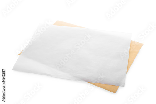 Sheets of baking paper on white background photo
