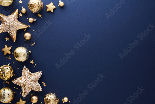 Luxury gold Christmas decorations on dark blue background. Xmas greeting card template, Happy New Year banner mockup.