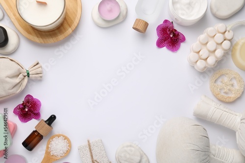 Frame with different spa products and space for text on white background, flat lay. Beautiful composition