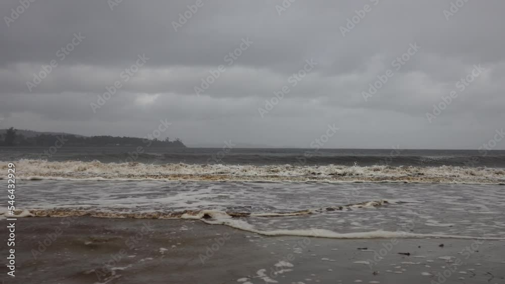 rough waves in a storm at a beach at a coast town in australia, rough waves in a storm at a beach at a coast town in australia,