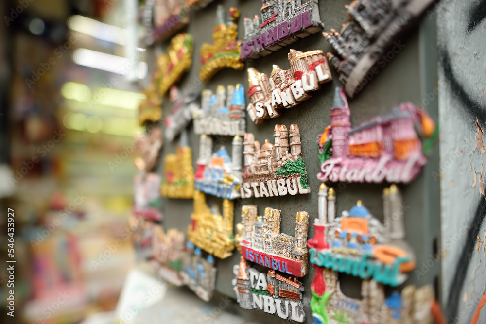 Sale of magnets, postcards, bottle openers, bookmarks, calendars, key rings and other souvenirs on the street of Istanbul. Gift and keepsakes from travels by Turkey.