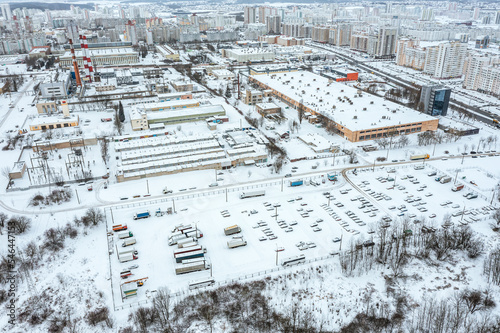 aerial overhead view of industrial area in urban residential district at winter time. drone photo.