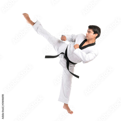 Taekwondo high kick - black belt  taekwondo athlete martial arts master , handsome man show high kick pose during fighter training isolated on white background