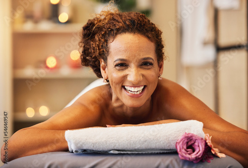 Spa, wellness and woman in massage and body therapy portrait, happy and relax with stress relief and self care. Happiness, luxury and holistic treatment, health and relaxation with massage therapy.