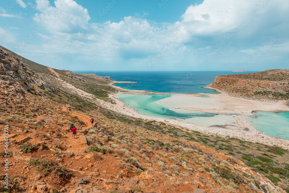 Balos lagoon, crete island, greece: hiking to the white sandy beach and turquoise blue water at the main tourist destination near chania