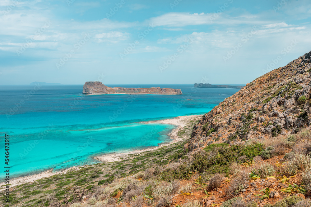 Balos lagoon, crete island, greece: view to gramvoussa island with white sandy beach and turquoise blue water at the main tourist destination near chania