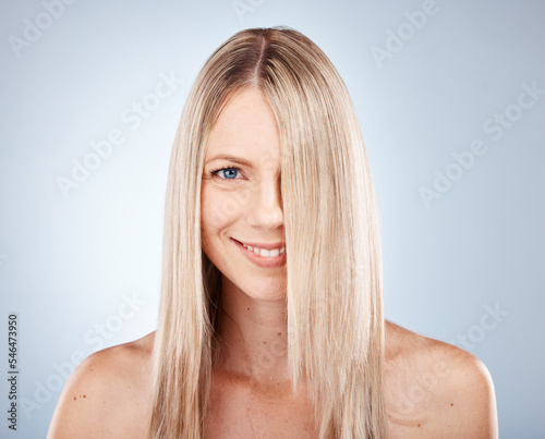 Hair, woman and portrait of blond lady with healthy hair for beauty and haircare. Hair care, hairstyle and face of blonde female for cosmetology or wellness on a grey studio background