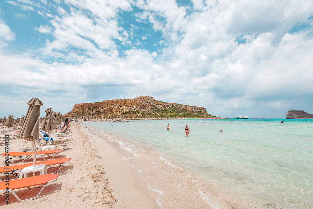 Balos lagoon, crete island, greece: view to gramvoussa island with white sandy beach and turquoise blue water at the main tourist destination near chania