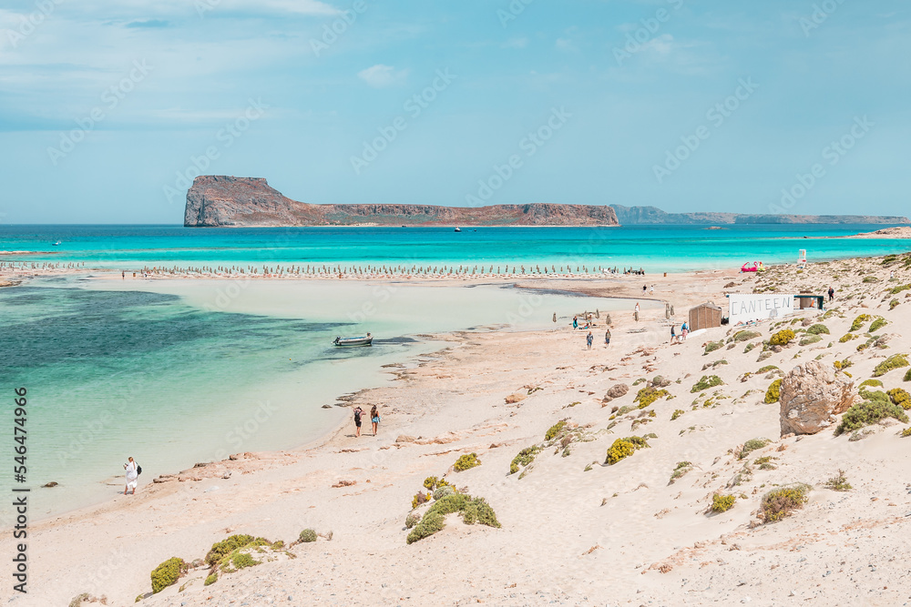 Balos lagoon, crete island, greece: view to gramvoussa island with white sandy beach and turquoise blue water at the main tourist destination near chania
