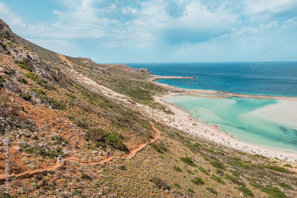 Balos lagoon, crete island, greece: view to gramvoussa island with white sandy beach and turquoise blue water at the main tourist destination near chania