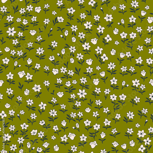 Seamless vintage pattern. small white flowers . green background. vector texture. fashionable print for textiles and wallpaper.