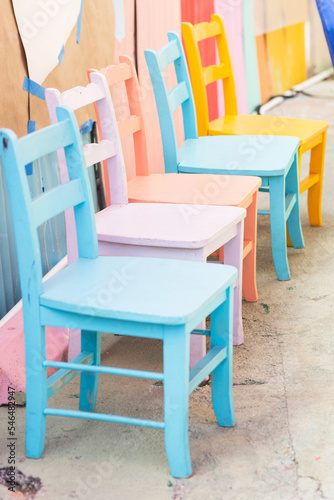 Painted Wooden Chairs. Colorful furniture for kids. Horizontal photo. Blue, pink, orange, yellow 