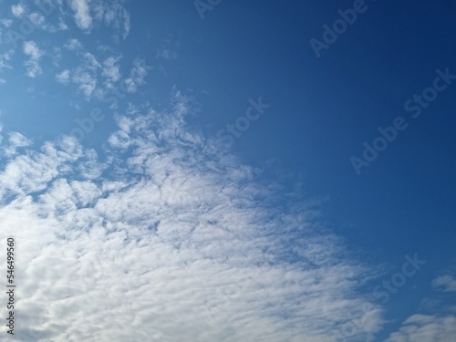 Winter sky with soft white clouds, bright blue sky, beautiful.