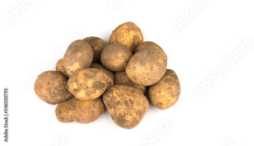 Stack of unwashed potatoes on a white background
