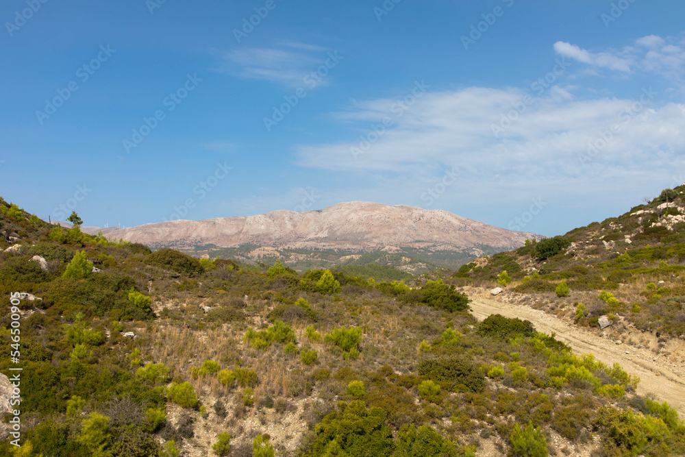 Sandy country road, 4x4 off-road trail to the peak of Attavyros mountain. Highest mountain on Rhodes island, Greece.trail. Dodecanese Greece. Sandy country road, 4x4 off-road trail to the peak of Attavyros mountain. Highest mountain on Rhodes island, Greece.trail. Dodecanese Greece.