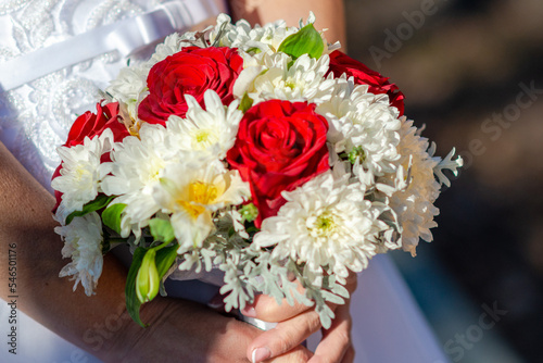 The bride holds a wedding bouquet. Wedding day